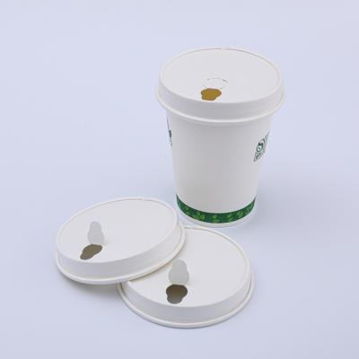 Compostable take away paper coffee cups with lids